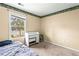 Bedroom featuring neutral walls, carpet floors, and a window with natural light at 531 Chadborn Ct, Lawrenceville, GA 30045