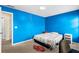 Bedroom featuring blue walls, carpet, and a bright window view at 531 Chadborn Ct, Lawrenceville, GA 30045
