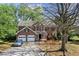 Traditional two-story brick home featuring a two-car garage, manicured landscaping, and a long driveway at 531 Chadborn Ct, Lawrenceville, GA 30045