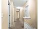 Upper level hallway with carpet floors and doors to bedrooms and bathrooms at 531 Chadborn Ct, Lawrenceville, GA 30045