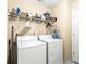 Functional laundry room featuring a side-by-side washer and dryer at 531 Chadborn Ct, Lawrenceville, GA 30045
