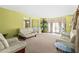 Bright living room featuring plush carpet, large windows, neutral decor, and ample seating at 531 Chadborn Ct, Lawrenceville, GA 30045