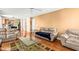 Comfortable living room with hardwood floors, ceiling fan, and lots of natural light at 531 Chadborn Ct, Lawrenceville, GA 30045