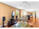 Living room with view of the kitchen, featuring hardwood floors and comfortable seating area at 531 Chadborn Ct, Lawrenceville, GA 30045