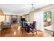 Bright living room with hardwood floors, brick fireplace, and open floor plan to kitchen and backyard at 531 Chadborn Ct, Lawrenceville, GA 30045