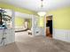 Inviting living room with carpeted floors, chandelier, and white trim; cozy and bright space at 531 Chadborn Ct, Lawrenceville, GA 30045
