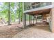 View of the backyard showing space under a screened porch with play area at 4314 Arbor Bridge Ct, Marietta, GA 30066