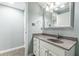 Bathroom featuring a single vanity, framed mirror, and tile flooring at 4314 Arbor Bridge Ct, Marietta, GA 30066