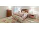 Comfortable bedroom featuring a wood headboard, matching furniture, and a beautiful flower themed area rug at 4314 Arbor Bridge Ct, Marietta, GA 30066