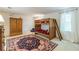 Spacious bedroom with wooden bunk beds, a patterned rug, and large windows providing plenty of natural light at 4314 Arbor Bridge Ct, Marietta, GA 30066