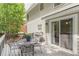 Back deck equipped with gas grill, table, chairs and slider door to the interior at 4314 Arbor Bridge Ct, Marietta, GA 30066