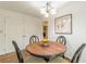 Cozy breakfast nook featuring a round table, unique chairs, and stylish light fixture at 4314 Arbor Bridge Ct, Marietta, GA 30066