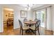 Dining area boasts hardwood floors, access to a deck, and natural light at 4314 Arbor Bridge Ct, Marietta, GA 30066