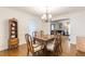 Traditional dining room featuring hardwood floors, elegant lighting, and classic furnishings at 4314 Arbor Bridge Ct, Marietta, GA 30066