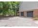 Rear exterior of house showing brick and concrete driveway with attached garage at 4314 Arbor Bridge Ct, Marietta, GA 30066