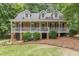 Charming brick home with a welcoming front porch and well-maintained lawn at 4314 Arbor Bridge Ct, Marietta, GA 30066