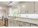 Bright kitchen featuring granite countertops, stainless steel appliances, and white cabinetry at 4314 Arbor Bridge Ct, Marietta, GA 30066