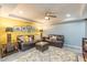 Finished basement living room with tray ceiling, recessed lighting, and leather furniture at 4314 Arbor Bridge Ct, Marietta, GA 30066