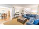 Inviting living room featuring an open staircase, hardwood floors and large sectional sofa at 4314 Arbor Bridge Ct, Marietta, GA 30066