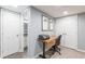 Home office with desk, chair, and view into adjacent bathroom at 4314 Arbor Bridge Ct, Marietta, GA 30066