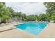 Community pool view with lounge chairs, umbrellas, and building at 4314 Arbor Bridge Ct, Marietta, GA 30066
