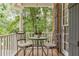 Charming front porch with vintage chairs and a small table, perfect for enjoying the outdoors at 4314 Arbor Bridge Ct, Marietta, GA 30066
