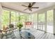 Bright sun room with screened windows and door, comfortable seating, and wooded views at 4314 Arbor Bridge Ct, Marietta, GA 30066