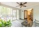 Relaxing sunroom with wicker furniture and view to backyard at 4314 Arbor Bridge Ct, Marietta, GA 30066