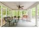 Sunroom with wooded backyard views and ample seating, perfect for relaxation at 4314 Arbor Bridge Ct, Marietta, GA 30066