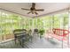Bright and airy sunroom with large windows offering views of the surrounding trees at 4314 Arbor Bridge Ct, Marietta, GA 30066