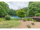 Scenic tennis court with lush greenery and mature trees creating a tranquil and picturesque setting at 4314 Arbor Bridge Ct, Marietta, GA 30066