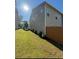 Well-maintained backyard with green grass, a fence, and low shrubs at 5726 Silver Lake Dr, Mableton, GA 30126