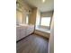 Bathroom boasts double sinks, white cabinets, a soaking tub, and bright vanity lighting at 5726 Silver Lake Dr, Mableton, GA 30126
