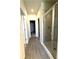 Bathroom featuring stylish grey tile walk-in shower with glass door and modern fixtures at 5726 Silver Lake Dr, Mableton, GA 30126