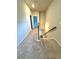 Carpeted hallway with a view of the staircase at 5726 Silver Lake Dr, Mableton, GA 30126