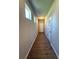 Bright hallway with sleek wood floors and natural light from windows at 5726 Silver Lake Dr, Mableton, GA 30126