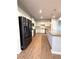 Modern kitchen featuring stainless steel appliances, granite countertops, and wood-look flooring at 5726 Silver Lake Dr, Mableton, GA 30126