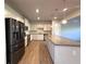 Spacious kitchen with white cabinets, granite countertops, and stainless steel appliances at 5726 Silver Lake Dr, Mableton, GA 30126