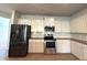 Spacious kitchen with stainless steel appliances and light-colored cabinets at 5726 Silver Lake Dr, Mableton, GA 30126