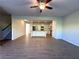 Open-concept living room and kitchen with sleek wood floors and recessed lighting at 5726 Silver Lake Dr, Mableton, GA 30126