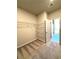 Spacious walk-in closet with built-in wire shelving and plush carpeting at 5726 Silver Lake Dr, Mableton, GA 30126