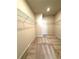 Large walk-in closet featuring wire shelving on three sides and plush carpeting at 5726 Silver Lake Dr, Mableton, GA 30126