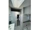 Bright bathroom features a sleek vanity, a tiled shower-tub combo, and lots of natural light at 6325 Stablewood Way, Lithonia, GA 30058