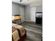 Bedroom features wood-look floors and two fish tanks at 6325 Stablewood Way, Lithonia, GA 30058