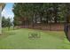 Spacious backyard featuring a turf-lined dog run at 7540 Shadburn Ferry Rd, Cumming, GA 30041