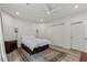 Bedroom with a ceiling fan, light colored wood floors, and an area rug at 7540 Shadburn Ferry Rd, Cumming, GA 30041