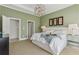 Serene bedroom featuring a plush bed, modern lighting, and neutral decor for a relaxing retreat at 7540 Shadburn Ferry Rd, Cumming, GA 30041