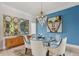 Elegant dining room featuring stylish lighting, artwork, and comfortable seating at 7540 Shadburn Ferry Rd, Cumming, GA 30041