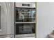 Sleek Dacor double steam ovens built into cabinetry, providing top-of-the-line cooking technology at 7540 Shadburn Ferry Rd, Cumming, GA 30041
