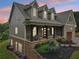 Beautiful two-story home with stone accents and a welcoming covered porch to enjoy outdoor living at 7540 Shadburn Ferry Rd, Cumming, GA 30041